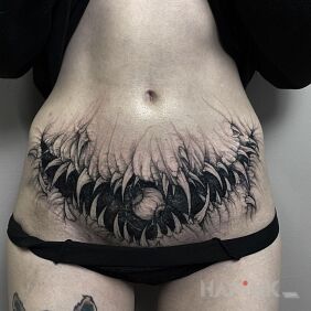 Tattoo Toothed belly on the stomach motif: black and gray style: graphic / illustrative