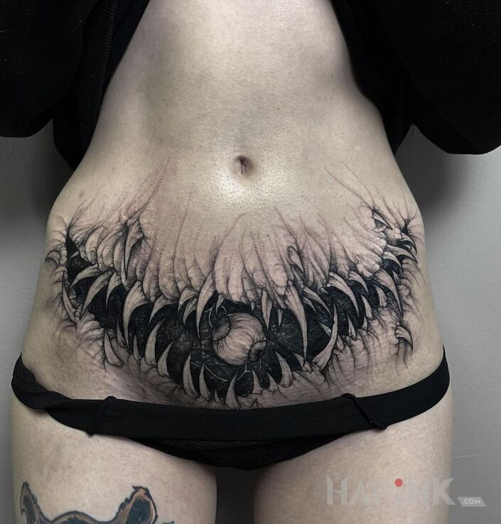 Tattoo Zębaty brzuch in black and gray motif and graphic / illustrative style on the stomach