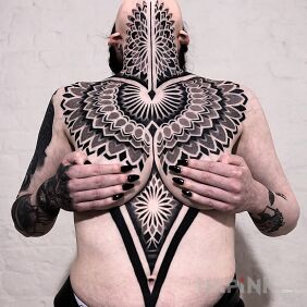 Tattoo Geometric precision underboob motif: mandalas style: dotwork