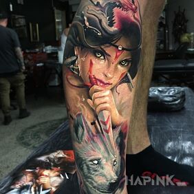Tattoo Girl with a wolf on the calf motif: colorful style: graphic / illustrative