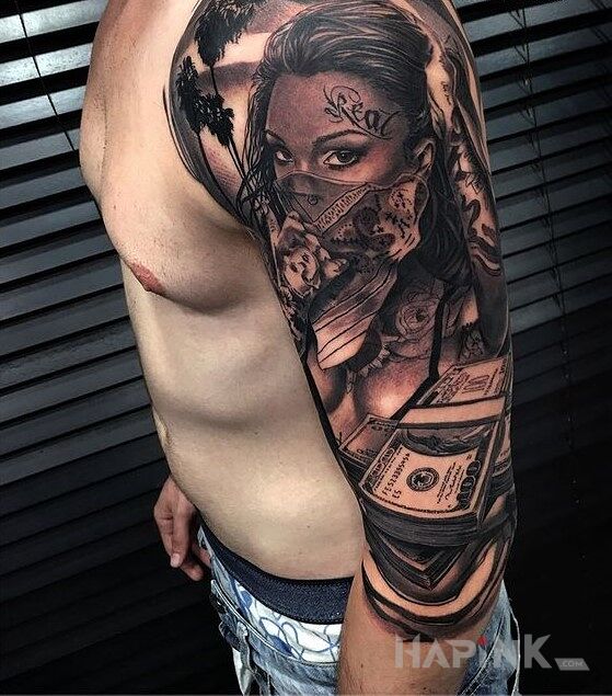 Tattoo Real dolary in black and gray motif and chicano style on the upper arm