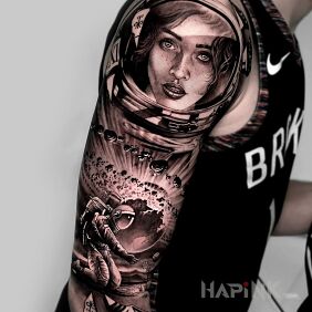 Tattoo Woman in space on the upper arm motif: faces style: realistic