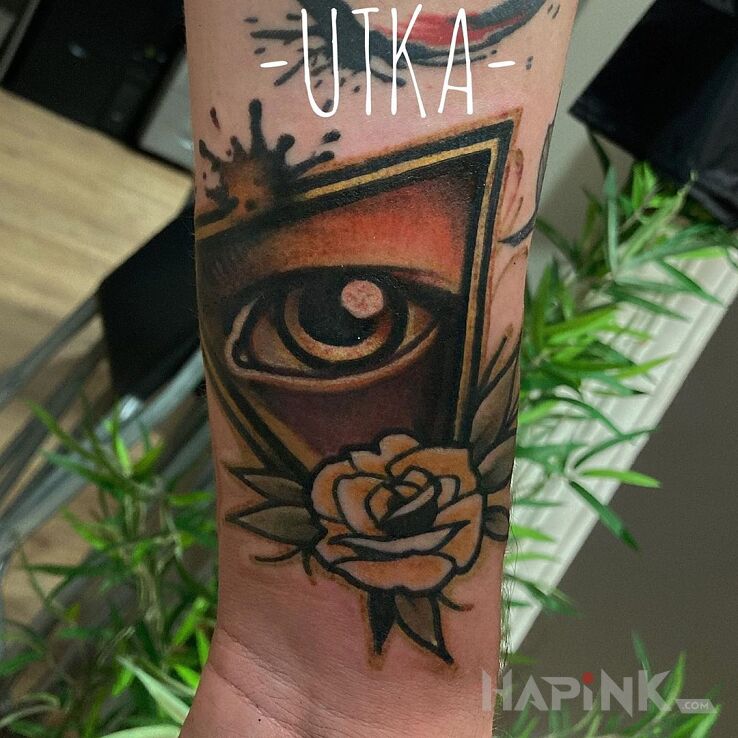 Tattoo Oko in colorful motif and graphic / illustrative style on the forearm