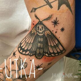 Tattoo Night butterfly on the forearm motif: colorful style: graphic / illustrative