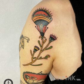 Tattoo Folk flowers on the upper arm motif: flowers style: graphic / illustrative