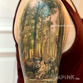 Tattoo Forest on the upper arm motif: animals style: realistic