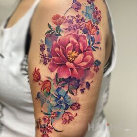 Tattoo Flowers on the upper arm motif: flowers style: realistic
