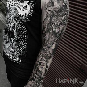 Tattoo Killer wolves on the upper arm motif: animals style: graphic / illustrative