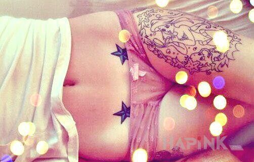 Tattoo Dwie gwiazdki i syrenka in sexy motif on the stomach