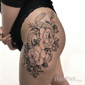 Tattoo Floral composition with a snake on the leg motif: black and gray style: graphic / illustrative