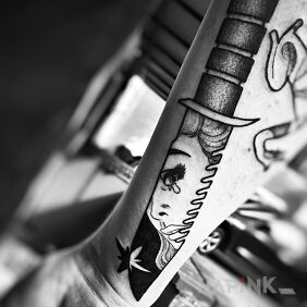 Tattoo Knife with reflection on the forearm motif: black and gray style: cartoon / comic book