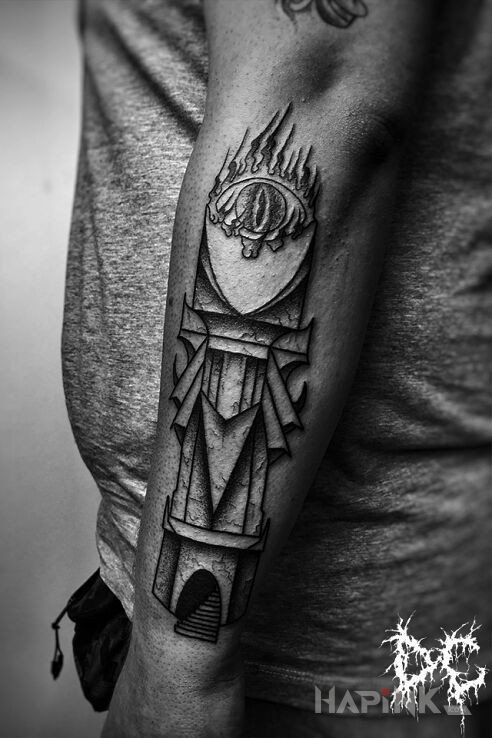 Tattoo Wieża Saurona in dark motif and graphic / illustrative style on the forearm