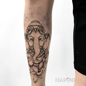 Tattoo Elephant with mandala on the leg motif: black and gray style: graphic / illustrative