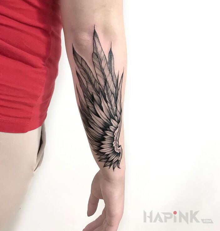 Tattoo Skrzydło in wings motif and graphic / illustrative style on the forearm