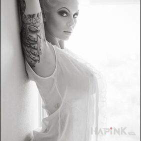 Tattoo Blonde with a tattoo on the upper arm motif: sexy