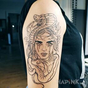 Tattoo Woman on the upper arm motif: faces style: contour / linework