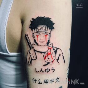 Tattoo Naruto on the upper arm motif: black and gray style: graphic / illustrative