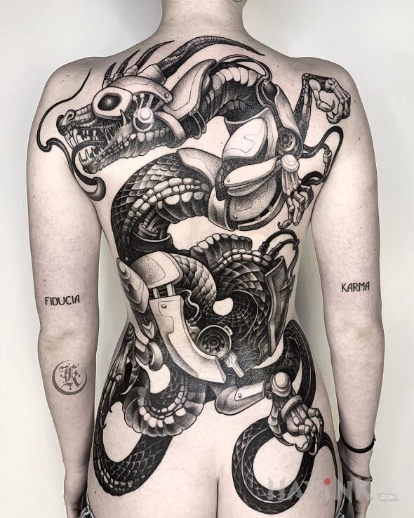 Tattoo Cybernetyczny smok in black and gray motif and realistic style on the shoulder blades