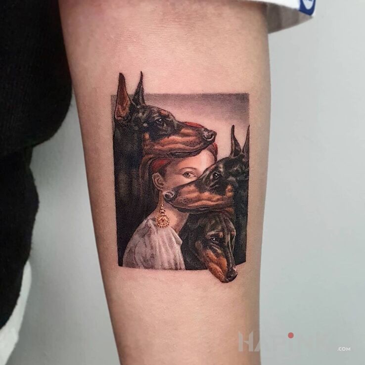 Tattoo Rottweilery in characters motif and realistic style on the forearm