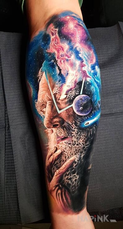Tattoo Tatuaż nie z tego świata in cosmos motif and realistic style on the forearm