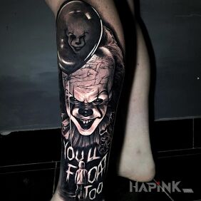 Tattoo Pennywise on the calf motif: characters style: realistic