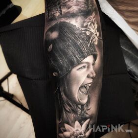 Tattoo Happy Girl on the forearm motif: black and gray style: realistic