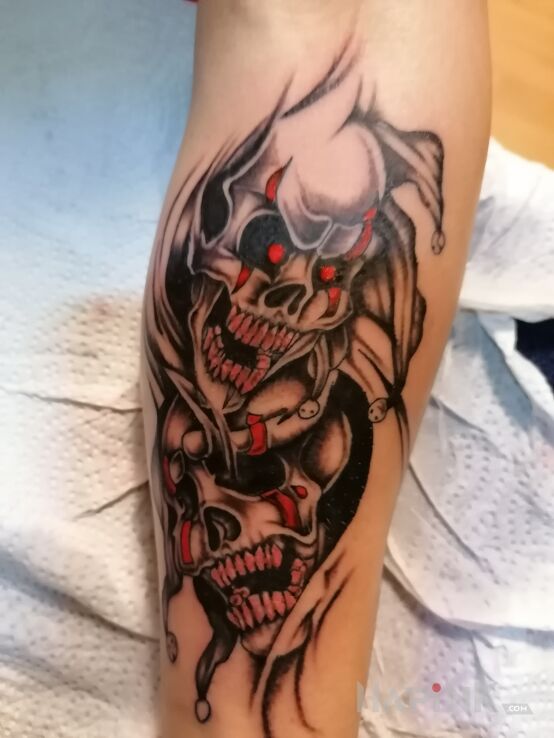 Tattoo CZASZKI in skulls motif and graphic / illustrative style on the forearm