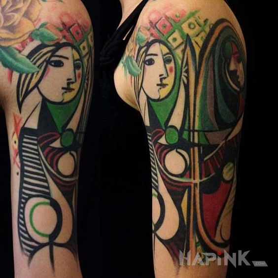 Tattoo Artyzm in colorful motif and modern / cubism style on the upper arm