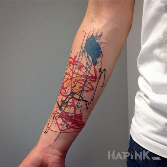 Tattoo Pomazane in colorful motif and abstract style on the forearm