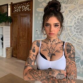 Tattoo Freckles on the forearm motif: wings style: minimalistic