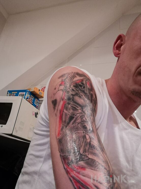 Tattoo Husar in patriotic motif on the upper arm