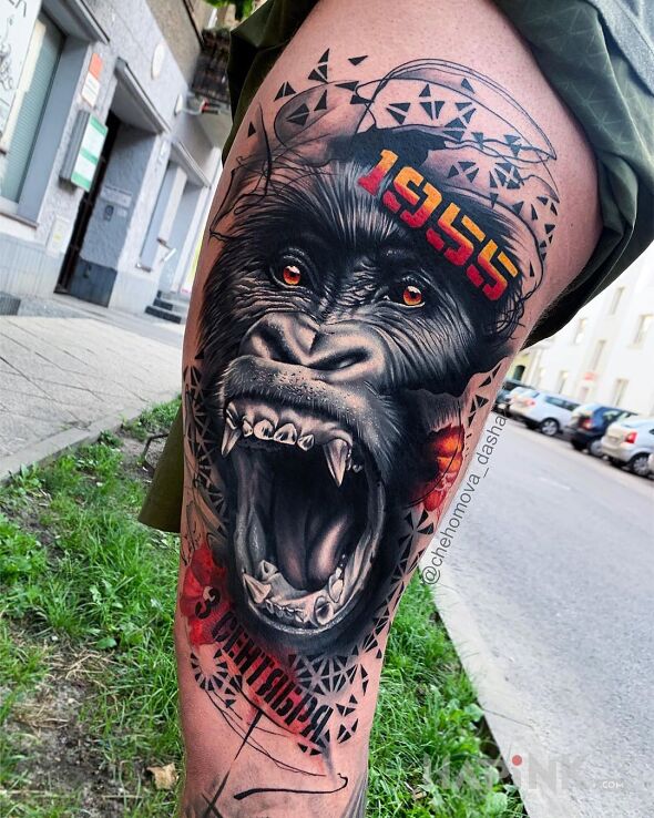 Tattoo Gorilla in colorful motif and realistic style on the leg