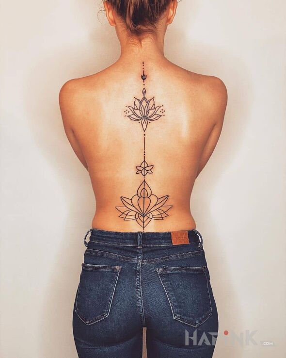 Tattoo Piękny kwiat lotosu in flowers motif and contour / linework style on the back