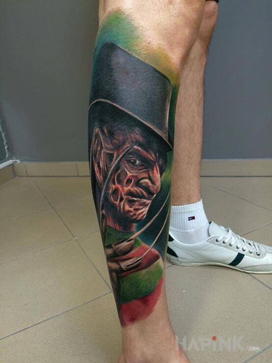 Tattoo Freddy Krueger in characters motif on the calf