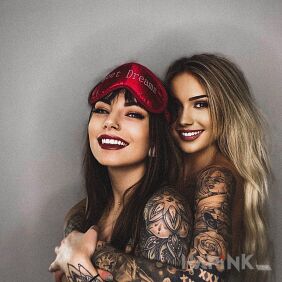 Tattoo Beautiful smiles on the upper arm motif: black and gray style: realistic
