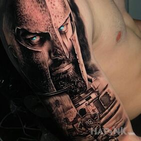 Tattoo From a footballer to a warrior on the upper arm motif: characters style: realistic