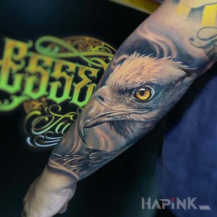 Tattoo Kozak orzel in colorful motif and realistic style on the forearm