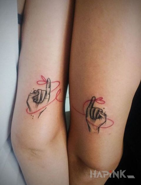 Tattoo Paluszki na wstążkę in Love motif and minimalistic style on the upper arm