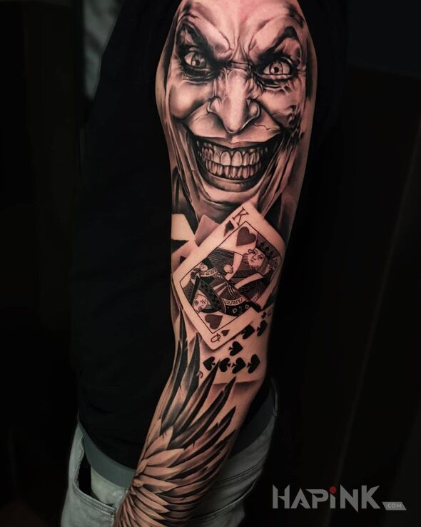 Tattoo Rękaw - Joker in objects motif and realistic style on the upper arm
