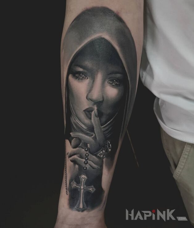 Tattoo Zakonnica in black and gray motif and realistic style on the forearm