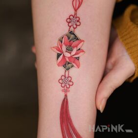 Tattoo Pendant with a flower on the forearm motif: objects style: graphic / illustrative