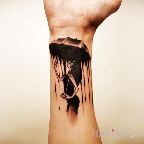 Tattoo Deszcz in characters motif on the forearm