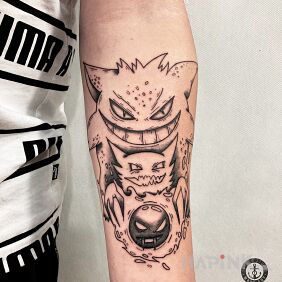 Tattoo Pokemon on the forearm motif: black and gray style: cartoon / comic book
