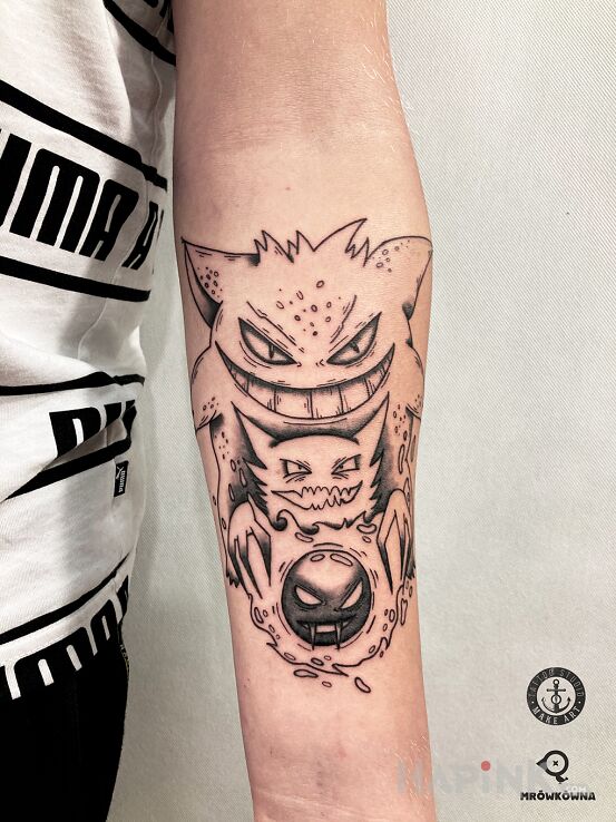 Tattoo Pokemony in characters motif and cartoon / comic book style on the forearm