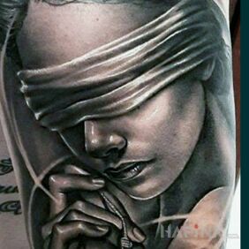 Tattoo Wonder not a tattoo on the upper arm motif: dark style: realistic