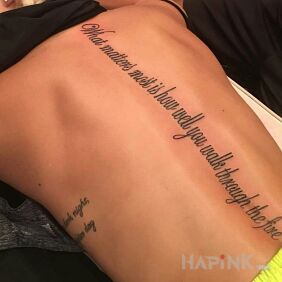Tattoo Walk Through Fire on the back motif: lettering style: calligraphy
