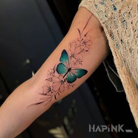 Tattoo Turquoise butterfly on the upper arm motif: black and gray style: realistic
