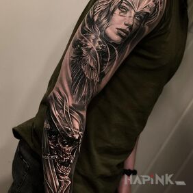 Tattoo Female warrior on the forearm motif: black and gray style: realistic