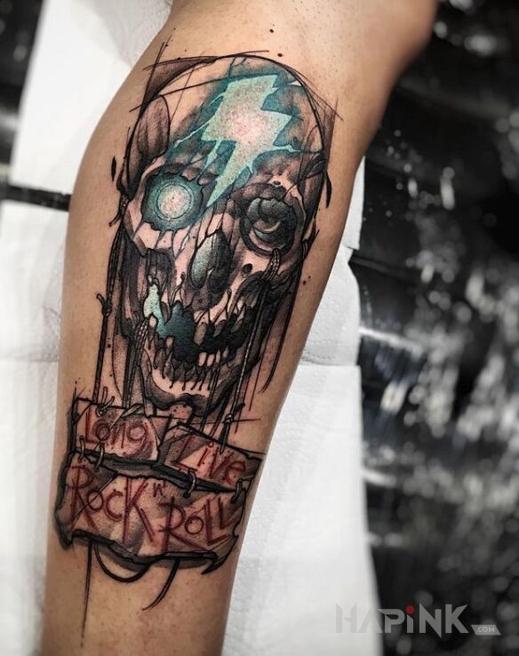 Tattoo Long Live Rock n' Roll in lettering motif on the leg