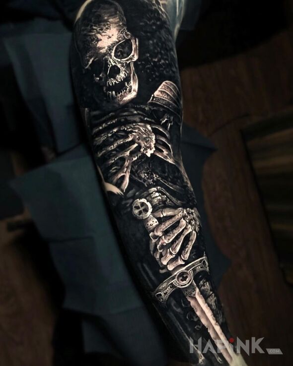 Tattoo Martwy wojak in objects motif and realistic style on the forearm
